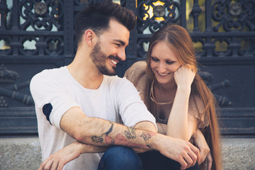 Beautiful young couple laughing in the city