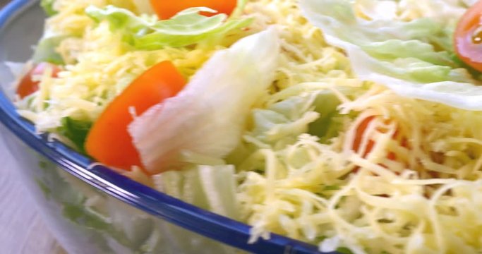 Beautiful colourful caesar salad with dressing croutons and parmesan cheese, healthy meal