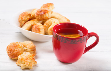 Tea with a lemon and cookies from puff pastry