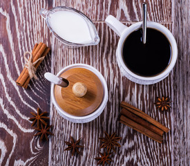 Fototapeta na wymiar black coffee on a wooden background