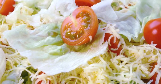 Beautiful colourful caesar salad with dressing croutons and parmesan cheese, healthy meal