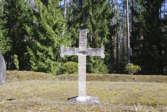 Old cross on the 19th - 20th century cemetery. 