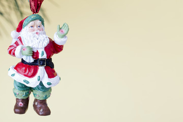 father santa hanging on christmas tree.