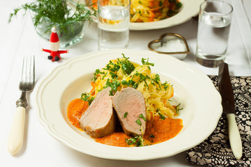 Pork with tagliatelli and sauce
