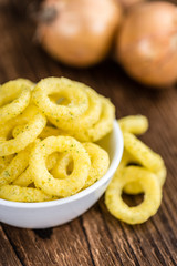 Onion Rings on wooden background
