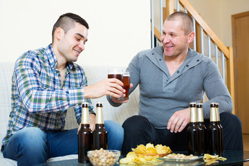 Two men drinking beer