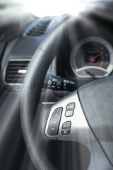 Obraz na płótnie Canvas Car Steering Wheel with shallow depth of field