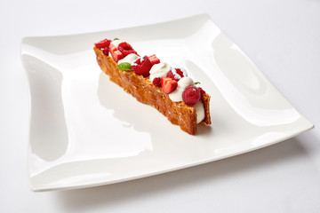 Milfey. dessert of puff pastry, vanilla cream and fruits