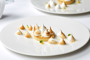 Tartlet with lemon curd and meringue horizontal close-up. desser