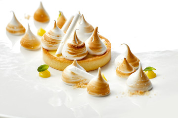 Tartlet with lemon curd and meringue horizontal close-up. desser