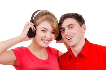 Couple two friends with headphones listening to music