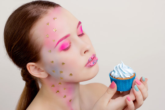 Candy Themed Styled Girl with Brown Hair  with blue cupcake