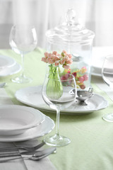 Table set at restaurant on light background