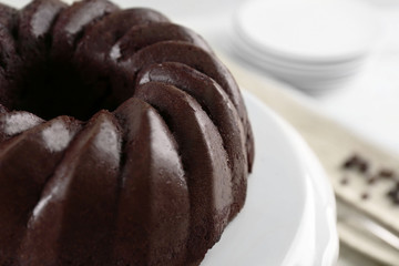 Chocolate cake on plastic mat, closeup