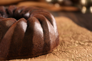Chocolate cake on craft paper, closeup