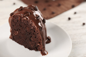 Piece of chocolate cake on a table, closeup