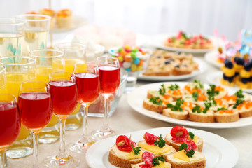 Set of cold snacks, canape, beverages, closeup