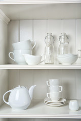 Dishes in cupboard in the kitchen