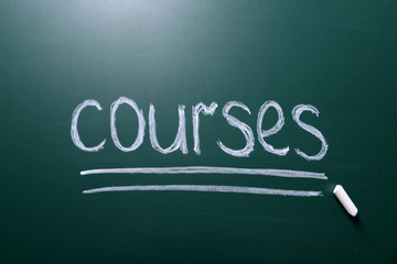 Courses inscription written with white chalk on blackboard