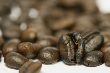 close up fresh coffee beans and isolated on white background , fresh material from market, healthy drink and international drink.