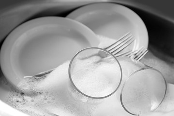 Dishes in kitchen sink closeup