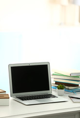 Laptop on the table in the office