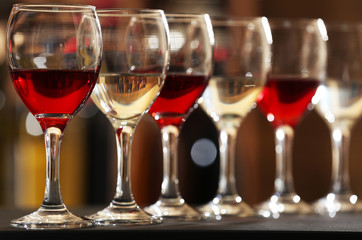 Glasses of red and white wine closeup