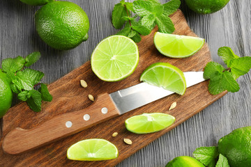 Fresh limes on cutting board