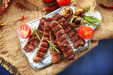Grilled beef with vegetables on cutting board