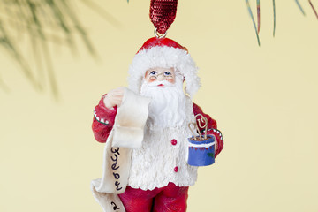 santa christmas bauble with a list and a vase.