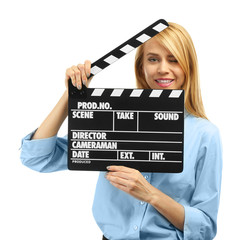 Young attractive woman holding film clapper isolated on white