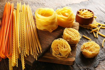 Uncooked pasta on cutting board, closeup