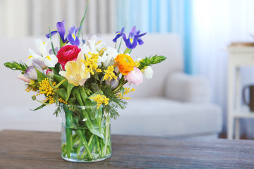 A bouquet of fresh flowers in a glass vase. - Powered by Adobe