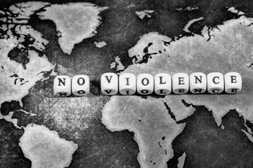 NO VIOLENCE on grunge world map, black and white