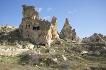 Freakish rocks with remnants of ancient dwellings of christians in the surrounding area of Goreme. Cappadocia, Turkey