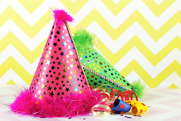 Party hats on a zigzag pattern background