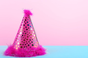 Pink party hat on pink background