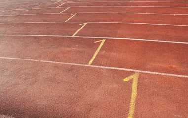 Fototapeta premium Ground athletics track has a symbol on the floor at the start.
