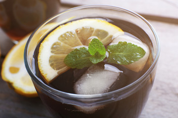 Glass of cola with ice, close up