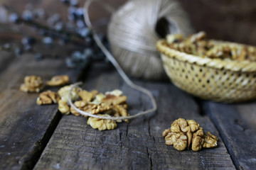Fototapeta premium peeled walnut on a wooden background