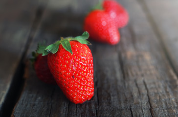 fresh strawberries on a wooden background