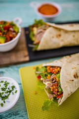 Tortilla with pulled pork, fresh vegetables