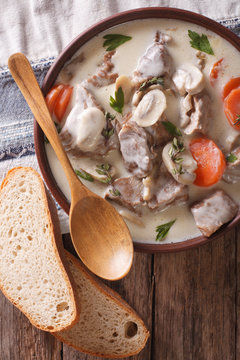 Blanquette of veal in a creamy sauce in a bowl. vertical top view
