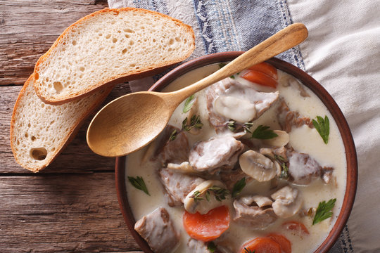 Blanquette of veal in a creamy sauce in a bowl. Horizontal top view
