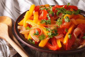Piperade Appetizer: stewed peppers with tomatoes and onions close up
