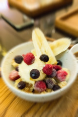 vanilla ice-cream and berry in white plate