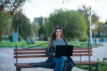 beautiful girl with a laptop and coffee