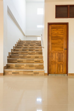 staircase and wood door in residential house
