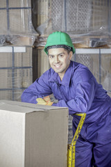 Workers In Warehouse Preparing Goods For shipping