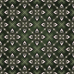 Fototapeta premium Decorative seamless golden texture on a green background.